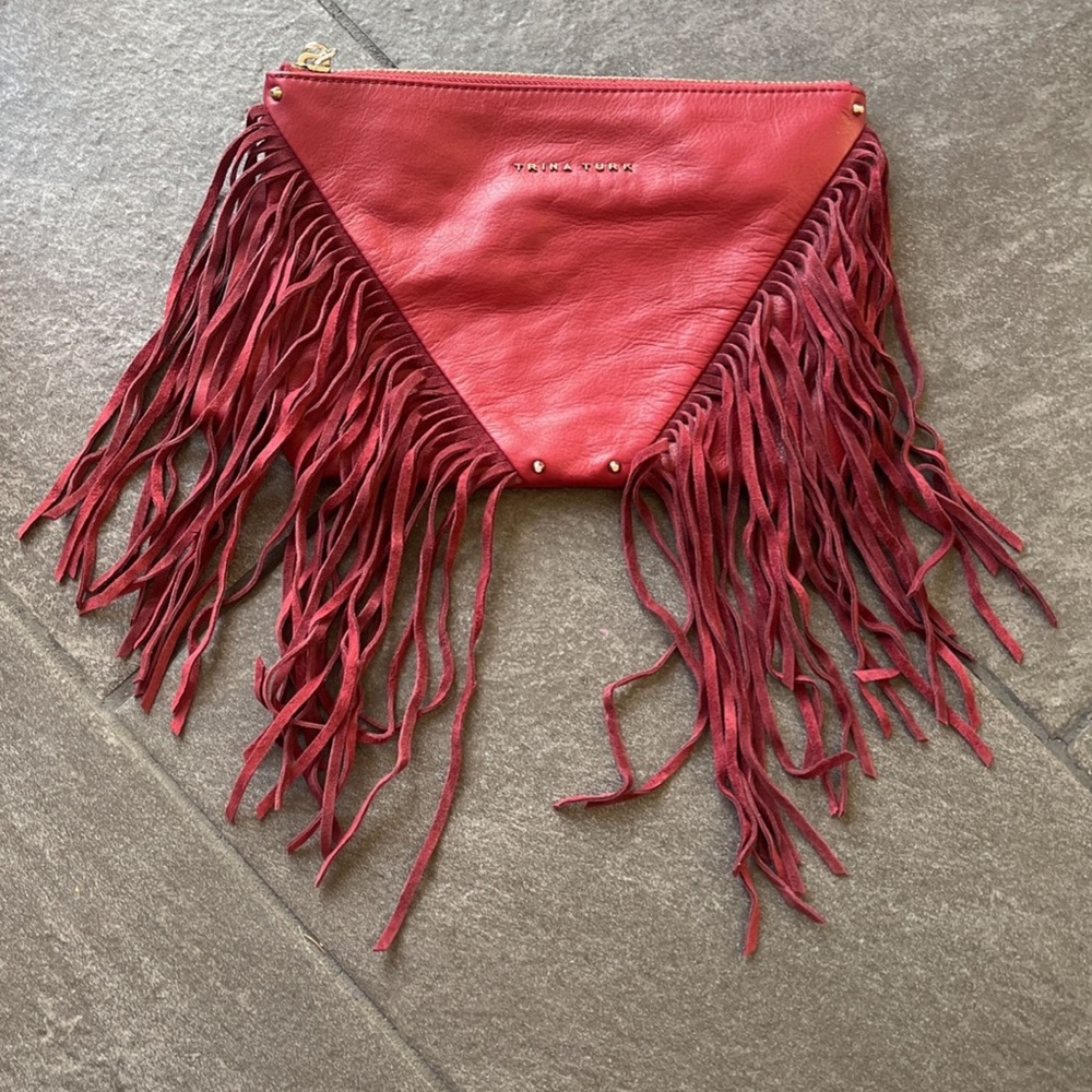 Trina Turk leather eternal fringe clutch with wristlet